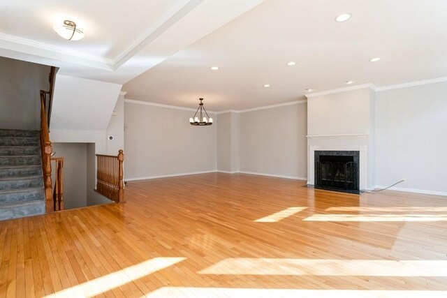 1855 Admiral Ct, Glenview, IL 60026 - unfurnished living room with light wood-style floors, a premium fireplace, crown molding, a chandelier, and recessed lighting