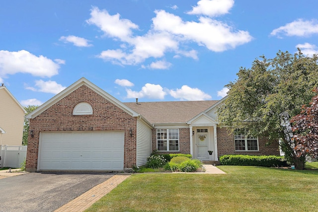 1611 Wintercrest Ln, Shorewood, IL 60404 - view of front of home with brick siding, asphalt driveway, an attached garage, and a shingled roof