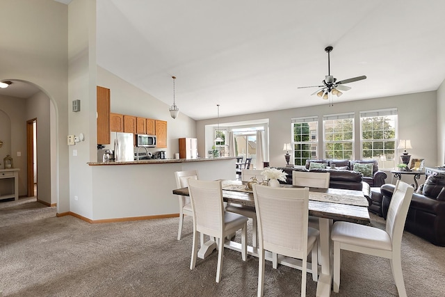 1611 Wintercrest Ln, Shorewood, IL 60404 - dining room with ceiling fan, light colored carpet, arched walkways, and vaulted ceiling