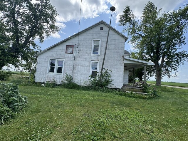 7915 N 4100 E Rd, Saybrook, IL 61770 - view of property exterior with a lawn
