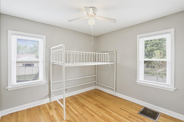 6000 S Mayfield Ave, Chicago, IL 60638 - unfurnished bedroom featuring light wood finished floors and a ceiling fan