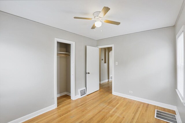 6000 S Mayfield Ave, Chicago, IL 60638 - unfurnished bedroom featuring light wood-style flooring, a closet, and ceiling fan