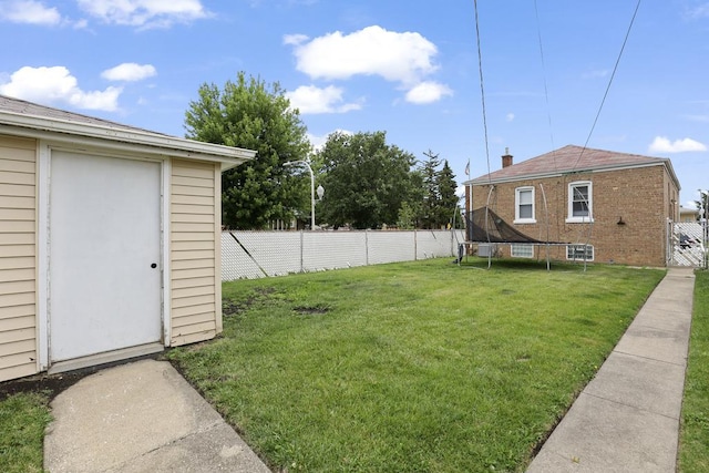 6000 S Mayfield Ave, Chicago, IL 60638 - fenced backyard with a trampoline and a storage unit