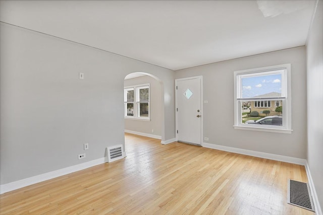 6000 S Mayfield Ave, Chicago, IL 60638 - foyer entrance with arched walkways, healthy amount of natural light, and light wood-type flooring