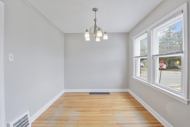 6000 S Mayfield Ave, Chicago, IL 60638 - spare room with a chandelier, light wood-type flooring, and ornamental molding