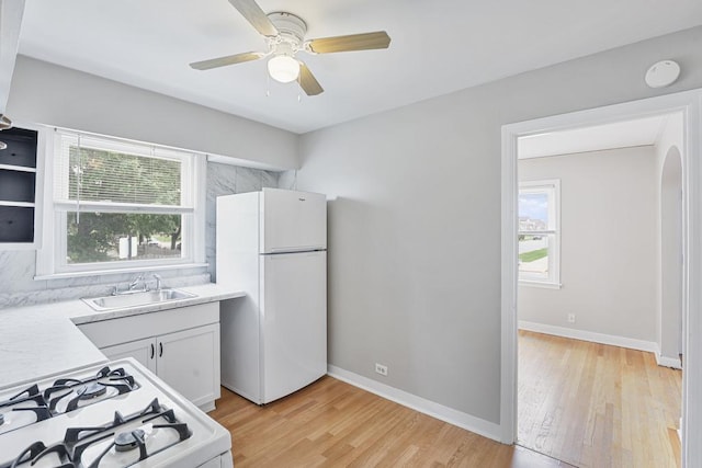 6000 S Mayfield Ave, Chicago, IL 60638 - kitchen with white appliances, plenty of natural light, light wood-type flooring, and light countertops