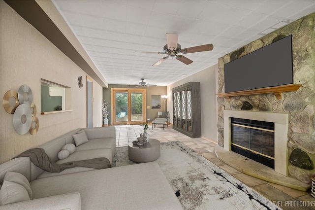 680 N Grace St, Lombard, IL 60148 - living area featuring a stone fireplace, a ceiling fan, and tile patterned flooring