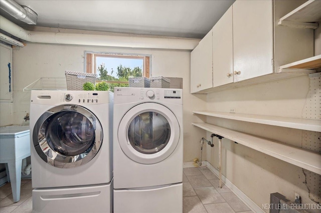 680 N Grace St, Lombard, IL 60148 - laundry room with washer and dryer, cabinet space, and light tile patterned flooring