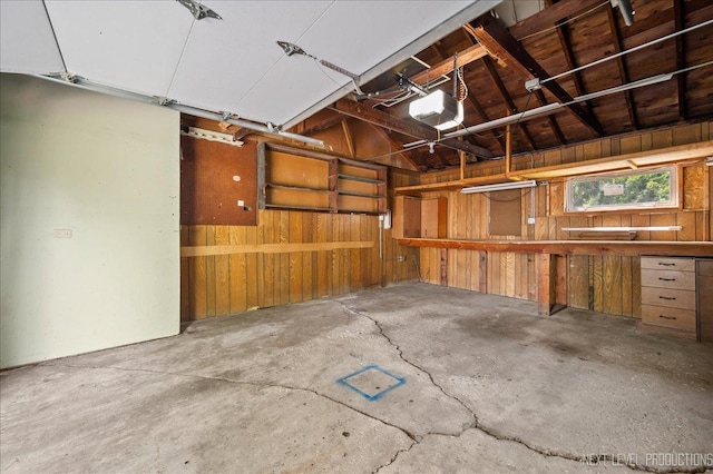 680 N Grace St, Lombard, IL 60148 - garage featuring a garage door opener and wood walls