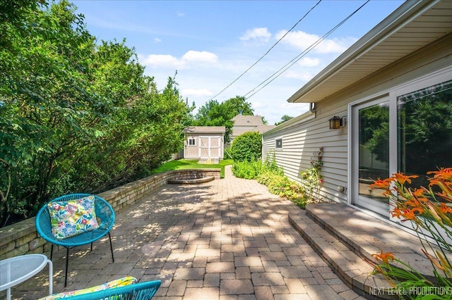 680 N Grace St, Lombard, IL 60148 - view of patio / terrace with a storage unit and a fire pit