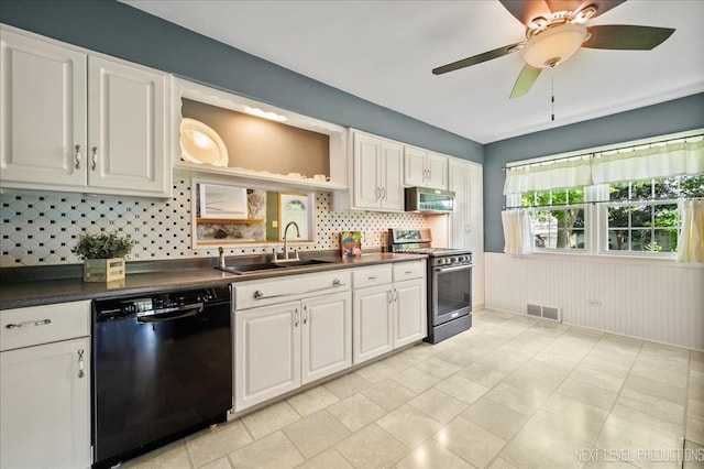 680 N Grace St, Lombard, IL 60148 - kitchen featuring appliances with stainless steel finishes, dark countertops, tasteful backsplash, white cabinetry, and a wainscoted wall