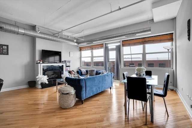 500 S Clinton St Unit 527, Chicago, IL 60607 - living room featuring light wood-style floors and a fireplace