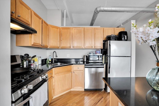 500 S Clinton St Unit 527, Chicago, IL 60607 - kitchen with appliances with stainless steel finishes, under cabinet range hood, light wood-style floors, and light brown cabinetry