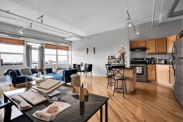 500 S Clinton St Unit 527, Chicago, IL 60607 - dining space with rail lighting and light wood-style flooring