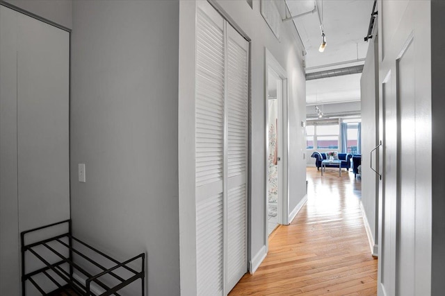 500 S Clinton St Unit 527, Chicago, IL 60607 - hallway featuring wood finished floors and rail lighting