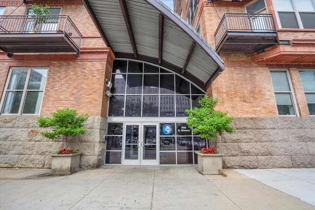 500 S Clinton St Unit 527, Chicago, IL 60607 - doorway to property with french doors, brick siding, and stone siding