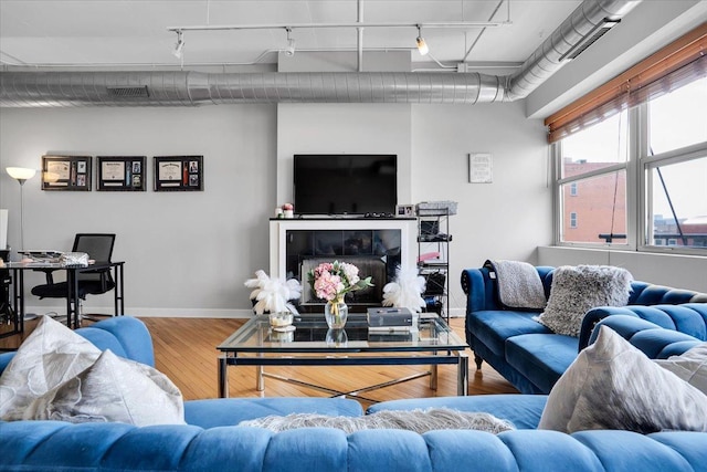 500 S Clinton St Unit 527, Chicago, IL 60607 - living room featuring wood finished floors and track lighting