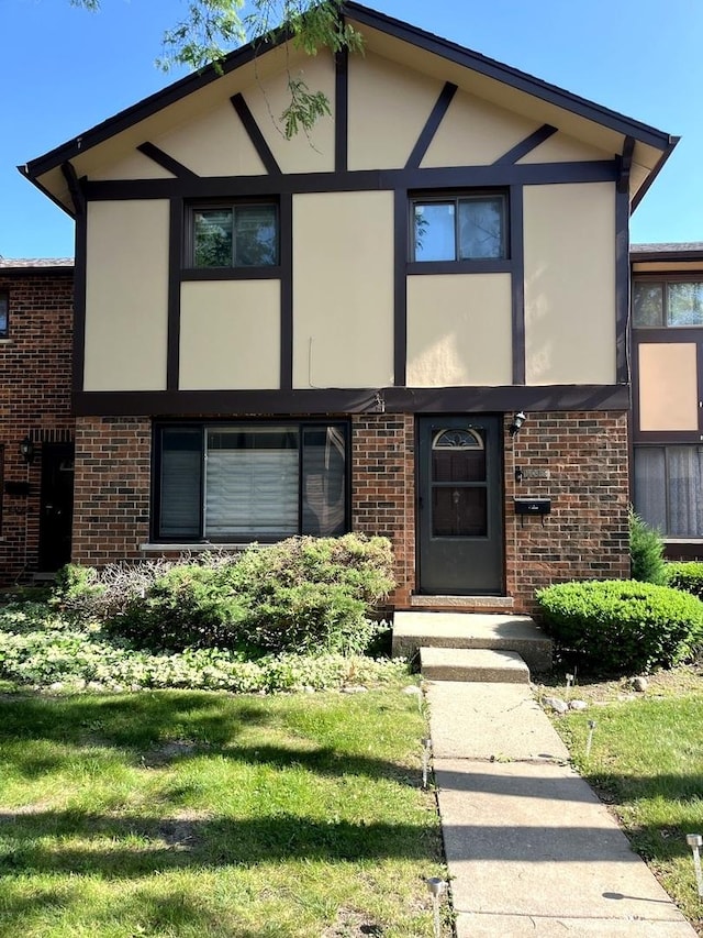 18W266 Standish Ln, Villa Park, IL 60181 - view of front facade with stucco siding, brick siding, and a front lawn
