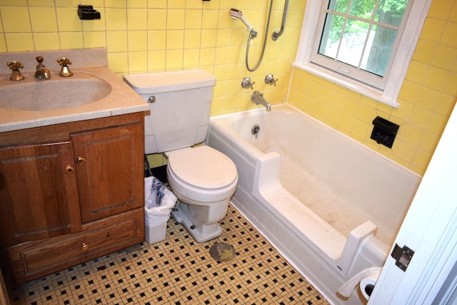 2008 Mcdaniel Ave, Evanston, IL 60201 - full bath with vanity, tile patterned flooring, tub / shower combination, tile walls, and tasteful backsplash