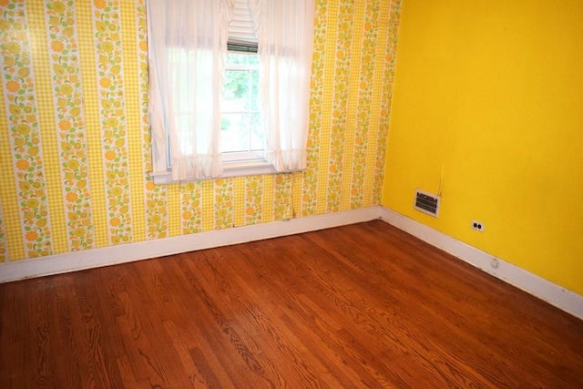 2008 Mcdaniel Ave, Evanston, IL 60201 - unfurnished room with wood finished floors and wallpapered walls