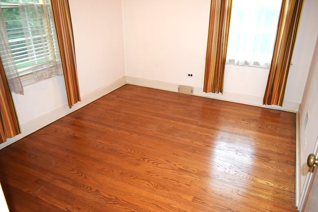 2008 Mcdaniel Ave, Evanston, IL 60201 - spare room with wood finished floors and healthy amount of natural light