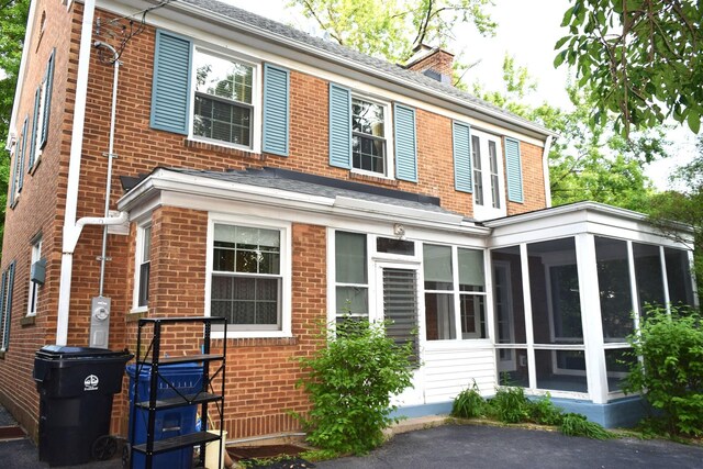 2008 Mcdaniel Ave, Evanston, IL 60201 - view of front of house featuring a sunroom and brick siding