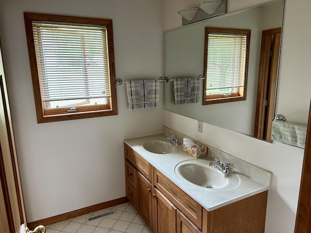 3468 E Spring Creek Dr, Ladd, IL 61329 - bathroom with double vanity and baseboards