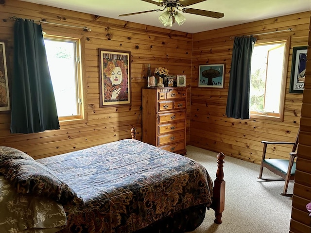 3468 E Spring Creek Dr, Ladd, IL 61329 - carpeted bedroom featuring wood walls and a ceiling fan