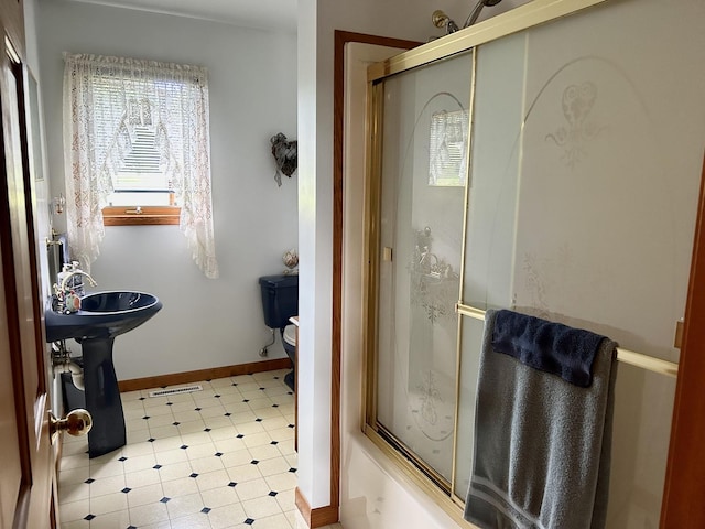 3468 E Spring Creek Dr, Ladd, IL 61329 - bathroom featuring healthy amount of natural light, tile patterned floors, and combined bath / shower with glass door