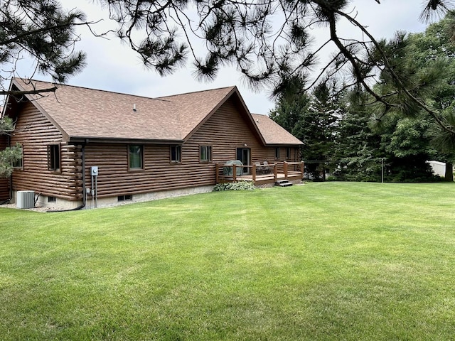 3468 E Spring Creek Dr, Ladd, IL 61329 - rear view of property with roof with shingles, log exterior, a deck, and a yard
