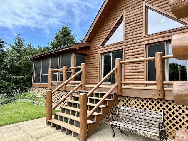 3468 E Spring Creek Dr, Ladd, IL 61329 - wooden terrace featuring stairs, a sunroom, and a lawn