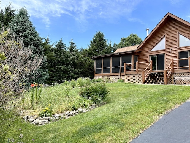 3468 E Spring Creek Dr, Ladd, IL 61329 - view of grassy yard with a sunroom and a wooden deck