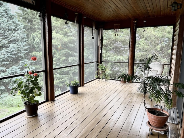 3468 E Spring Creek Dr, Ladd, IL 61329 - unfurnished sunroom featuring wood-type flooring, plenty of natural light, and wood ceiling