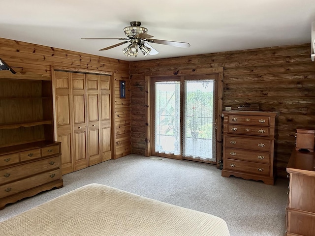 3468 E Spring Creek Dr, Ladd, IL 61329 - unfurnished bedroom featuring light carpet, a closet, ceiling fan, and access to exterior