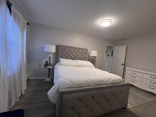 7125 Oconnell Dr Unit 102, Chicago Ridge, IL 60415 - bedroom with dark wood-style floors and a baseboard heating unit