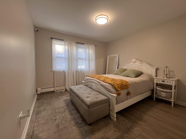 7125 Oconnell Dr Unit 102, Chicago Ridge, IL 60415 - bedroom with a baseboard heating unit and wood finished floors