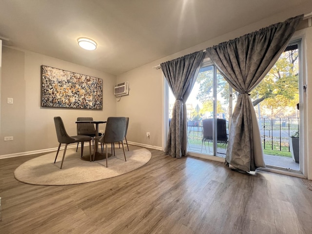7125 Oconnell Dr Unit 102, Chicago Ridge, IL 60415 - dining room featuring wood finished floors and a wall unit AC