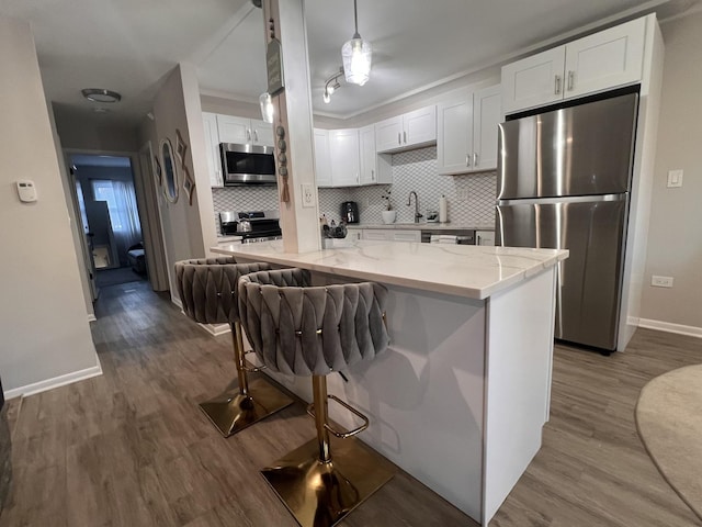 7125 Oconnell Dr Unit 102, Chicago Ridge, IL 60415 - kitchen with stainless steel appliances, white cabinetry, dark wood-type flooring, and backsplash