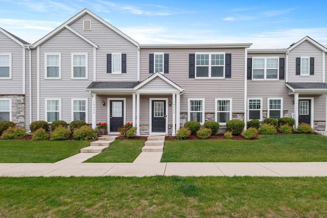 10425 Freedom Way, Cedar Lake, IN 46303 - townhome / multi-family property featuring stone siding and a front lawn