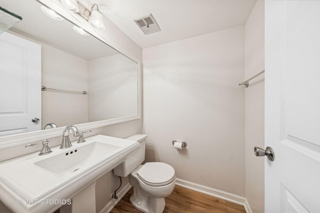 2733 Weeping Willow Dr Unit 26-C, Lisle, IL 60532 - bathroom featuring wood finished floors and toilet