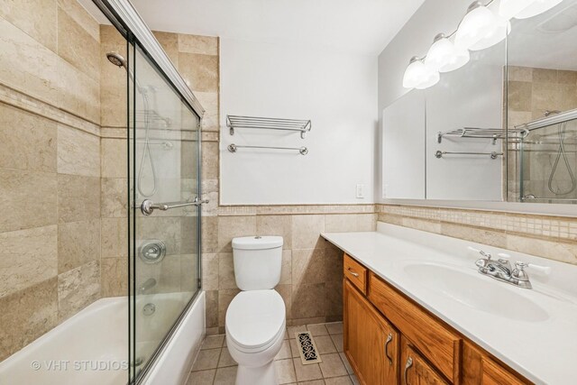 2733 Weeping Willow Dr Unit 26-C, Lisle, IL 60532 - bathroom with tile walls, vanity, tile patterned floors, combined bath / shower with glass door, and wainscoting