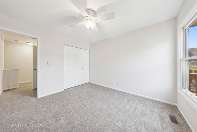 2733 Weeping Willow Dr Unit 26-C, Lisle, IL 60532 - unfurnished bedroom featuring carpet floors, a closet, and a ceiling fan