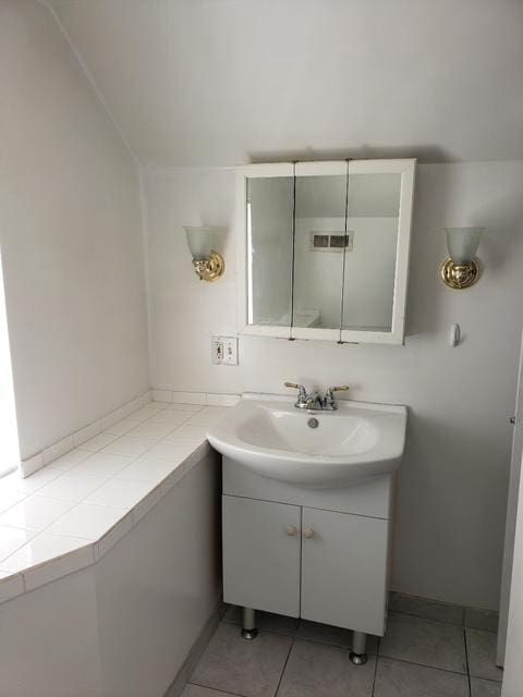 7155 W 71st St, Chicago, IL 60638 - bathroom with vanity and tile patterned floors