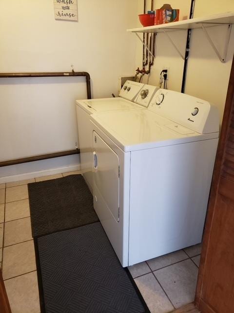 7155 W 71st St, Chicago, IL 60638 - laundry area with separate washer and dryer and tile patterned flooring