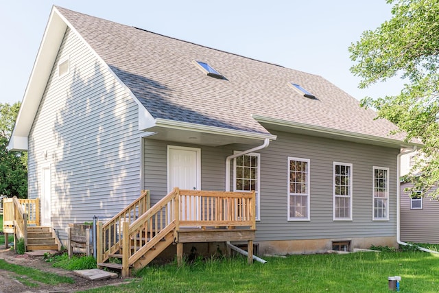 402 N St, Monroe Center, IL 61052 - back of house with a shingled roof and a yard
