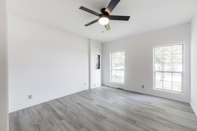 402 N St, Monroe Center, IL 61052 - unfurnished room featuring healthy amount of natural light, wood finished floors, and ceiling fan