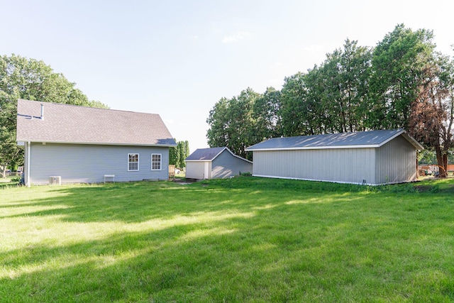 402 N St, Monroe Center, IL 61052 - view of green lawn featuring an outbuilding