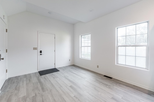 402 N St, Monroe Center, IL 61052 - unfurnished room featuring light wood finished floors and vaulted ceiling