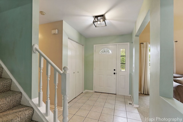 2184 N Masters Ln, Lake Villa, IL 60046 - foyer featuring light tile patterned floors and stairs