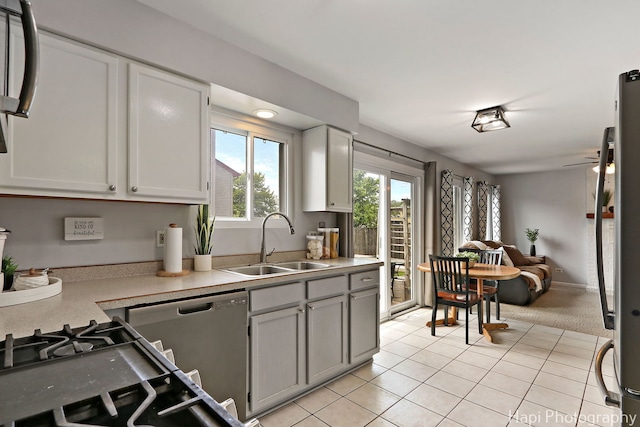 2184 N Masters Ln, Lake Villa, IL 60046 - kitchen with light countertops, dishwasher, light tile patterned floors, open floor plan, and freestanding refrigerator